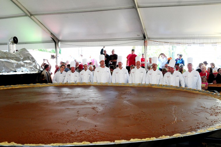 Halloween Fun Fact: The biggest pumpkin pie on record was 20 feet in diameter and weighed 3,699 pounds. It was baked by the New Breman Giant Pumpkin Growers in Ohio in 2010, breaking their own previous world's record of 2,020 pounds. The ginormous orange pie contained 1,212 pounds of pumpkin, 233 dozen eggs, 109 gallons of evaporated milk, 525 pounds of sugar, 7 pounds of salt, and 14.5 pounds of cinnamon.